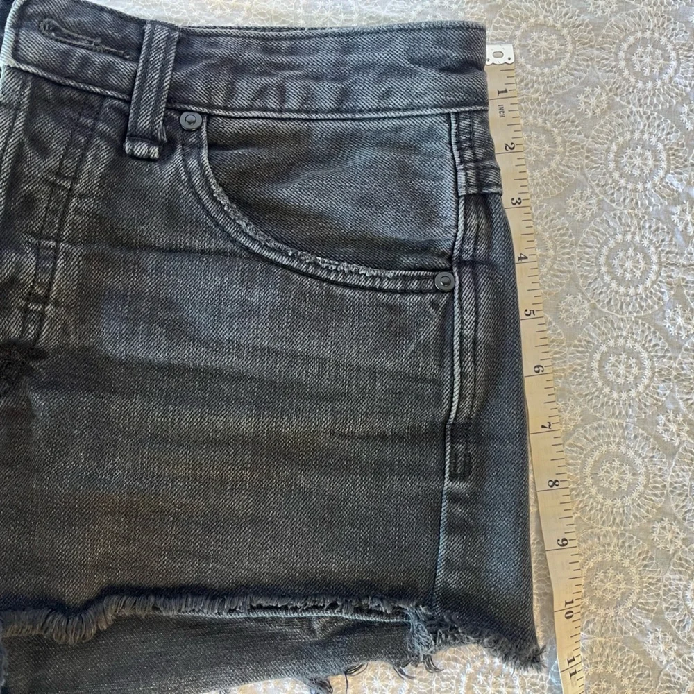 Free People black cut-off shorts, size 25; distressed black denim with raw hem
